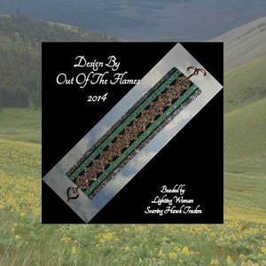 May include: A green and gold beaded bracelet with a heart-shaped clasp. The bracelet is on a white background with the text "Design By Out Of The Flames 2014" and "Beaded by Lighting Woman Soaring Hawk Traders".