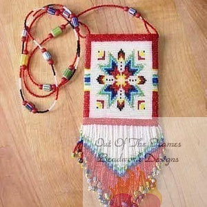 May include: A beaded necklace with a red, white and blue geometric pattern. The necklace has a fringe of beads at the bottom and is labelled "Out of the Flames Beadwork Designs".