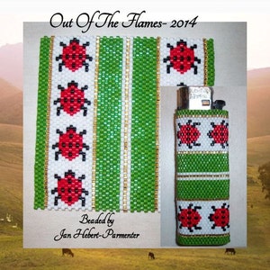 May include: A green and white beaded lighter cover with red ladybugs. The cover is beaded with a pattern of green and white stripes and red ladybugs. The text "Out Of The Flames - 2014" is at the top of the image. The text "Beaded by Jan Hebert-Parmenter" is at the bottom of the image.
