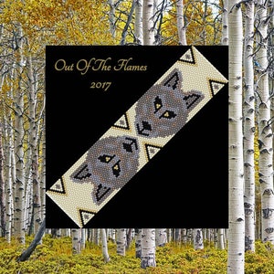 May include: A beaded bracelet with a wolf's face design in shades of gray, white, and yellow. The bracelet is set against a black background with the text "Out Of The Flames 2017".