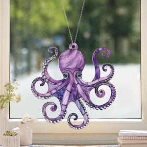 May include: Purple stained glass octopus hanging ornament with iridescent details and clear rhinestones.