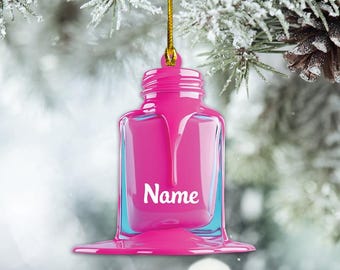 May include: Pink nail polish bottle Christmas ornament with a white "Name" label.