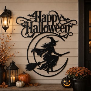May include: A black metal wall sign featuring the text Happy Halloween in a decorative script font, positioned above a circular frame containing a silhouette of a witch flying on a broomstick against a crescent moon, accented with small bats.