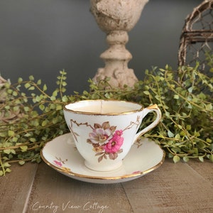 Vintage floral teacup candle and saucer