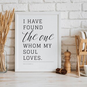May include: White framed print with black text that reads "I have found the one whom my soul loves. Song of Solomon 3:4"