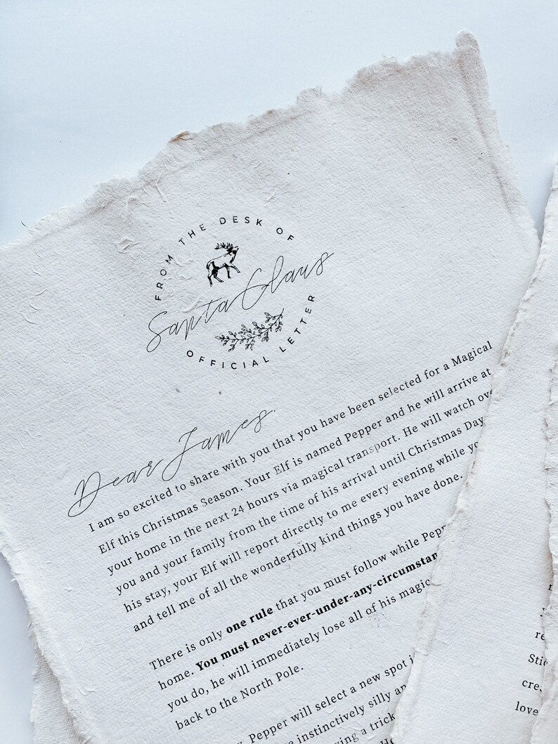 May include: Off-white paper with torn edges, featuring a handwritten letter from Santa Claus. The text includes "FROM THE DESK OF SANTA CLAUS OFFICIAL LETTER" and a message to "Dear James" about an elf named Pepper.