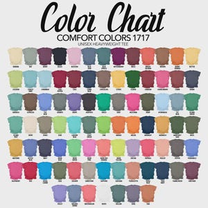 May include: A colour chart for Comfort Colors 1717 unisex heavyweight tee shirts. The chart shows a wide array of colours, including black, blue, green, pink, orange, and more. Each colour is represented by a small t-shirt graphic with the colour name below.