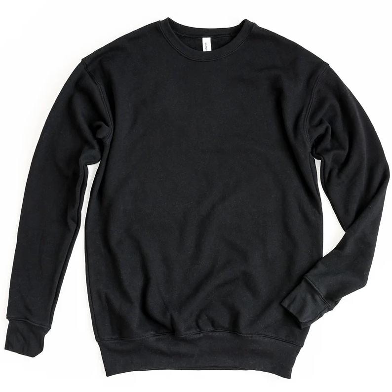 May include: A solid black crewneck sweatshirt. The long-sleeved top has a classic design with a ribbed hem and cuffs. The sweatshirt is made of a soft material and is suitable for casual wear. The tag is visible at the back of the neck.