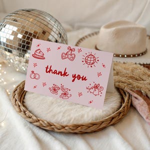 May include: A rustic wooden sign with the text "Welcome to our home" in white lettering. The sign features a distressed finish and a simple, inviting design, perfect for front door decor.