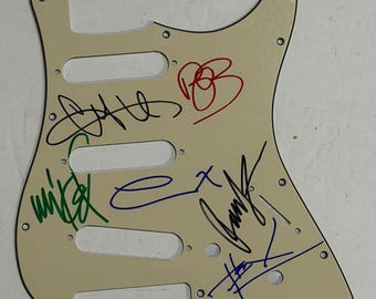 Stratocaster guitar pickguard signed by the band Linkin Park