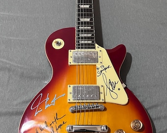 Les Paul-type guitar signed by the band Rush