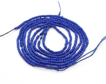 Three 11 inch strands of tiny lapis heishi beads, blue reconstituted semiprecious stone seed beads, average size 2mm