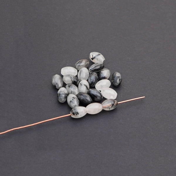 21 pcs small oval tourmalated quartz beads, opaque white and black semiprecious stone, average size 9mm
