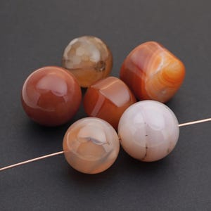 6 pcs designer assortment of red, orange, and white agate beads, round and barrel shapes, size ranges 18mm to 20mm