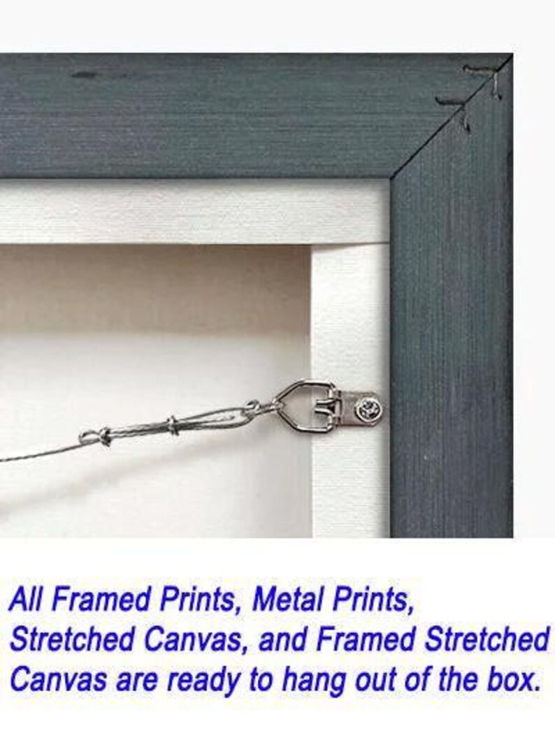A metal frame is attached to a stretched canvas, ready to hang out of the box.