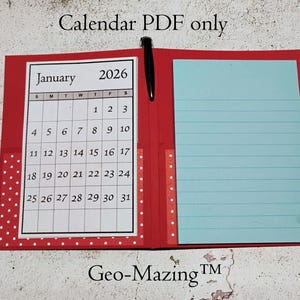 May include: A red calendar notebook with a January 2026 calendar page, a light blue lined notepad, and a black pen. The notebook has a white polka dot pattern on the left side. The text "Calendar PDF only" and "Geo-Mazing TM" are visible.