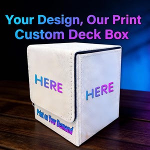 May include: A white custom deck box with the text "Your Design, Our Print Custom Deck Box" in a gradient color. The box has the word "HERE" printed on it in a gradient color. The text "Print on Your Demand" is also visible.