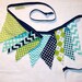 Tikisha Williams reviewed Pennant bunting fabric banner in navy blue, aqua, lime green - 9 double sided flags total