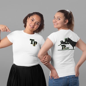 May include: Two white t-shirts with a green and black graphic design. The front shirt has the letters "TP" with a gold anchor. The back shirt has the letters "TP" with the text "Parker" and a silhouette of a person riding a bull.