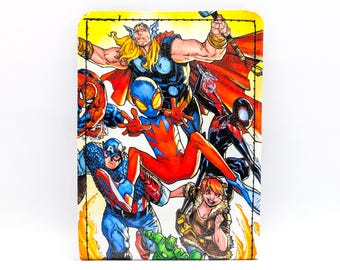 May include: A rectangular wallet featuring a vibrant comic book illustration of several superheroes, including Thor, Spider-Man, and Captain America. The artwork is detailed with bold colors and dynamic poses, set against a yellow background.