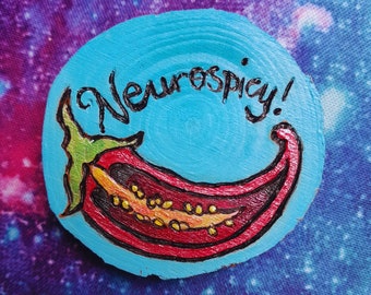 Pines, llaveros y chapas de neurospicy