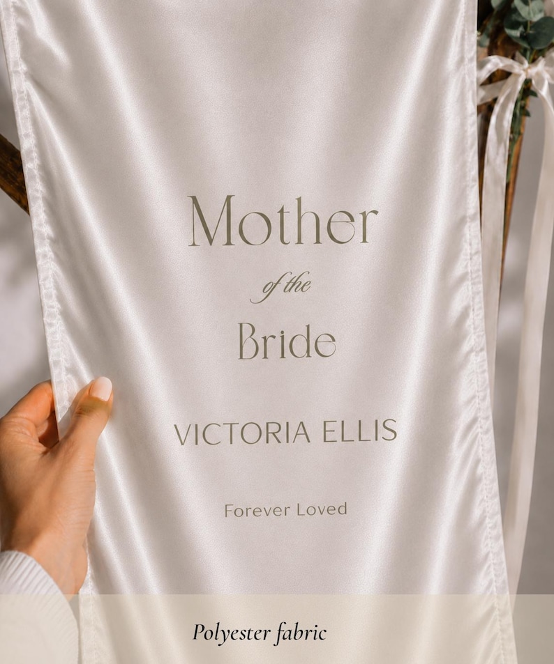 Close up of Mother of the Bride memorial banner on polyester fabric with elegant typography and personalized details