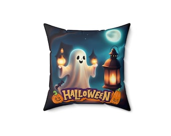 May include: A square throw pillow featuring a white ghost holding two glowing lanterns in a dark, moonlit scene with a house silhouette. The word HALLOWEEN is printed in orange and purple letters above two carved orange jack-o'-lantern pumpkins.
