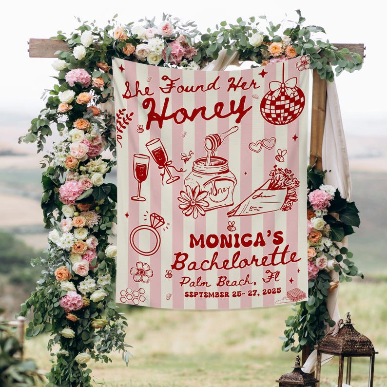 May include: A pink and white striped banner with the text "She Found Her Honey" and "Monica's Bachelorette Palm Beach, Fl September 25-27, 2025". The banner features illustrations of champagne glasses, a ring, and a jar of honey.
