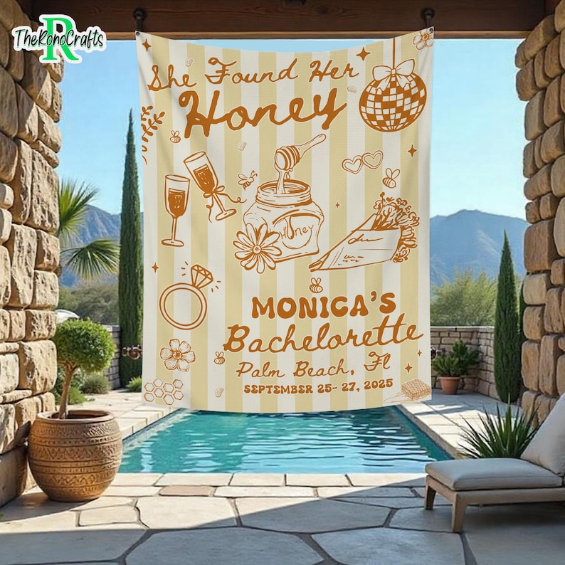 May include: A beige and white striped bachelorette party tapestry with the text "She Found Her Honey" and "Monica's Bachelorette Palm Beach, FL September 25-27, 2025". The tapestry features illustrations of a disco ball, champagne glasses, and a ring.
