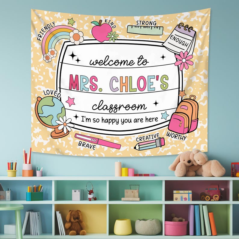 May include: A yellow and white classroom tapestry with a welcome sign that says "Welcome to Mrs. Chloe's Classroom." The sign is surrounded by colorful illustrations of a globe, pencils, backpacks, and stars. The tapestry also features the words "Friendly, Kind, Strong, Enough, Loved, Brave, Creative, Worthy".