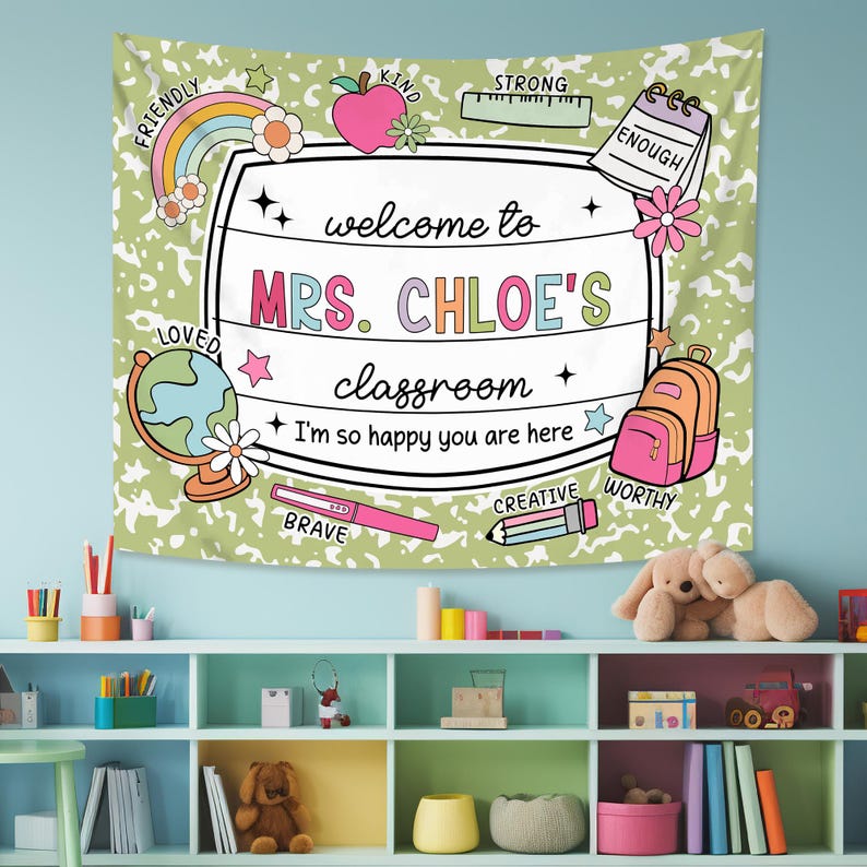 May include: A green and white tapestry with a welcome to Mrs. Chloe's classroom sign. The sign is surrounded by colorful illustrations of school supplies, stars, and words like 'friendly', 'kind', 'strong', 'enough', 'loved', 'brave', 'creative', and 'worthy'.