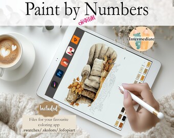 May include: Digital paint by numbers image on a tablet screen. The image is of a cozy armchair with fall-themed decor, including pumpkins and dried flowers. The image is labeled "Intermediate" and includes a color palette.