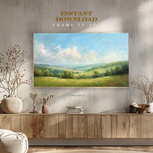 Pode incluir: Pintura de paisagem emoldurada retratando colinas verdes sob um céu azul com nuvens. A obra de arte está rotulada como "INSTANT DOWNLOAD FRAME TV ART" e "PINE TREE CA."