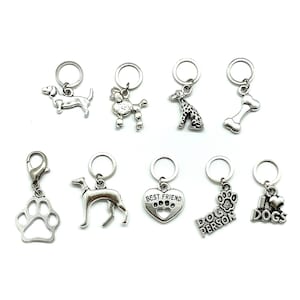 May include: A set of ten silver charm pendants featuring dog-themed designs. The charms include a dachshund, poodle, dalmatian, bone, paw print, greyhound, heart with the text "Best Friend", paw print with the text "Dog Person", and a heart with the text "I Love Dogs".