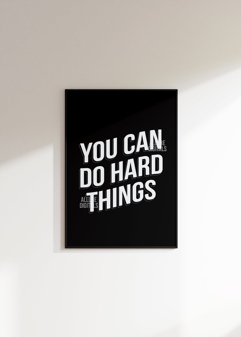 May include: Black and white motivational poster with the text "You can do hard things" in a bold, white font.