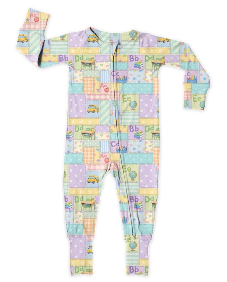 May include: A pastel-coloured baby sleepsuit with a patchwork design. The pattern includes school-related motifs such as apples, school buses, globes, and letters. The colour scheme features soft blues, greens, yellows, and purples.