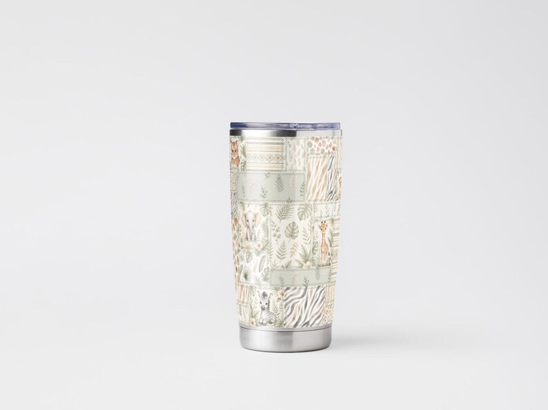 May include: A stainless steel travel tumbler with a patchwork design featuring safari animals and foliage in muted tones. The tumbler has a silver base and a dark blue lid, perfect for hot or cold beverages.