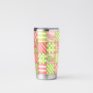 May include: A stainless steel tumbler with a colorful patchwork design featuring watermelon slices, stripes, and checkered patterns in pink, green, and white. The tumbler has a silver base and a dark blue lid.