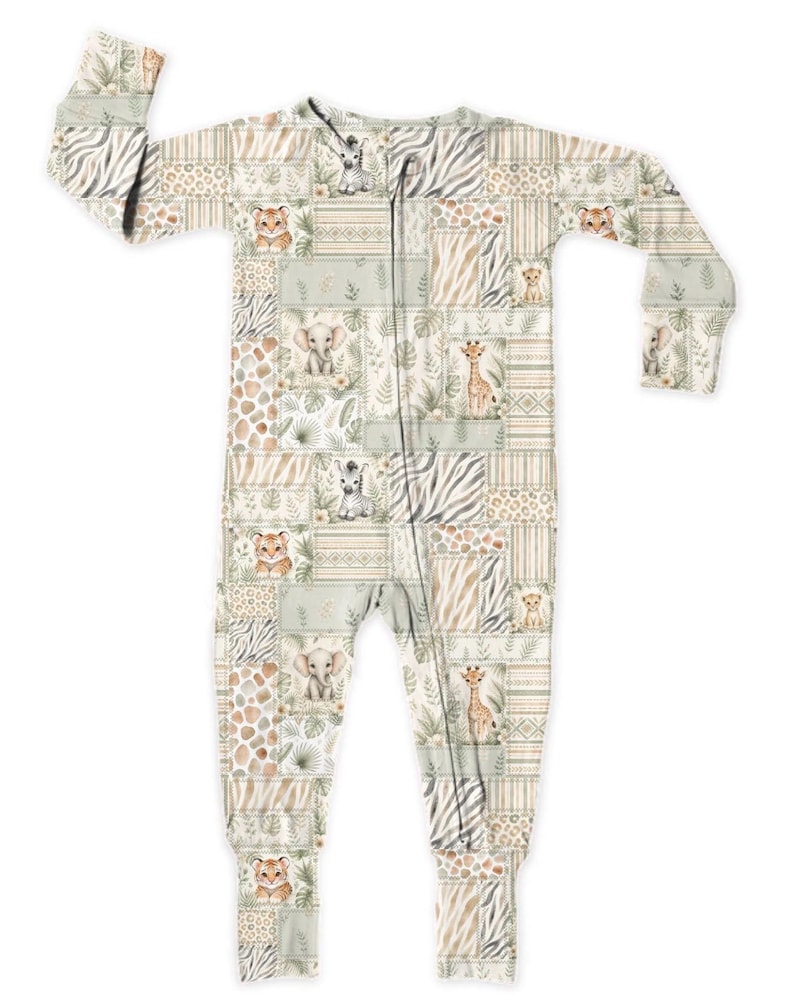 May include: A light-colored baby sleeper with a patchwork design featuring safari animals like lions, giraffes, and elephants. The sleeper has a zipper closure and long sleeves. The color palette includes beige, tan, and green.