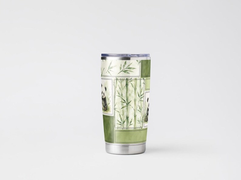 May include: Stainless steel tumbler featuring a patchwork design with panda bears and bamboo stalks. The tumbler has a silver lid and base, and the design incorporates shades of green and white. The overall theme is nature and wildlife.