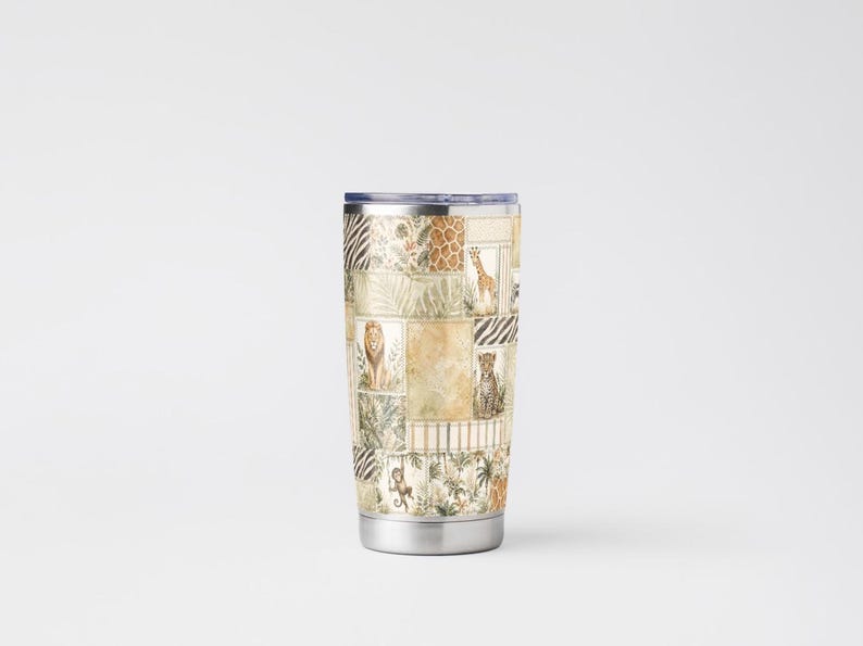 May include: A stainless steel travel tumbler with a patchwork design featuring various safari animals like lions, giraffes, and leopards. The tumbler has a silver base and a dark blue lid, perfect for hot or cold beverages.