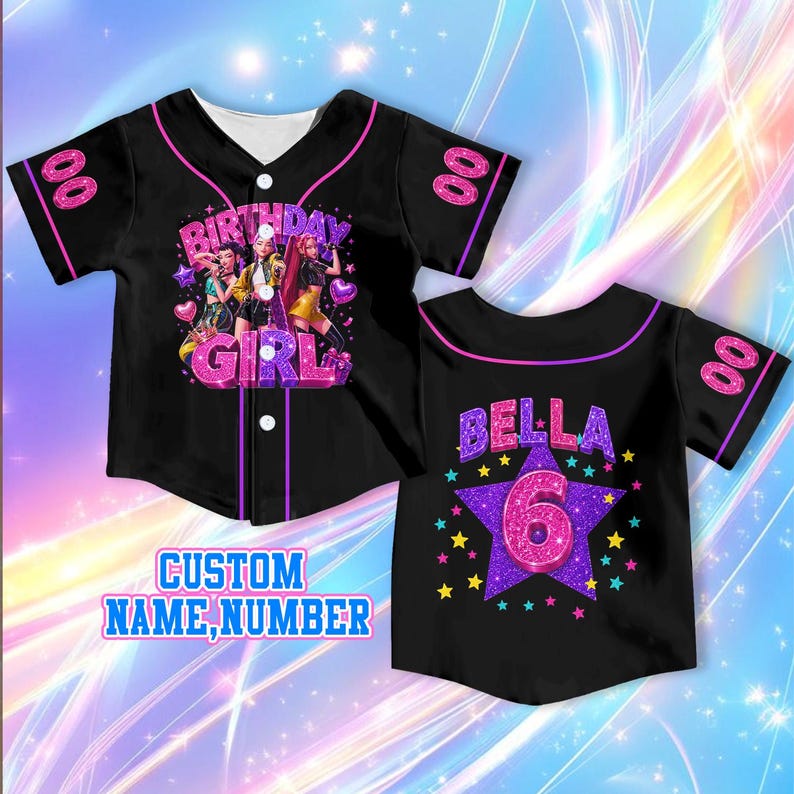 May include: A black baseball jersey with pink trim, featuring a front graphic of three figures and the text "BIRTHDAY GIRL" in glittery pink. The back displays the name "BELLA" above a large purple glittery star with the number "6" inside.