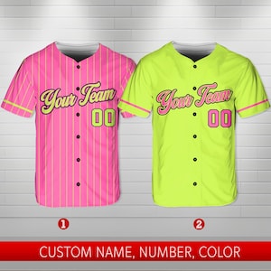 May include: Two baseball jerseys with a striped design. The jersey on the left is pink with yellow stripes and the jersey on the right is yellow with pink stripes. Both jerseys have the text "Your Team" and the number "00" on the front.