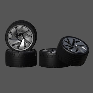 May include: Four black tires with silver rims. The rims have a multi-spoke design.