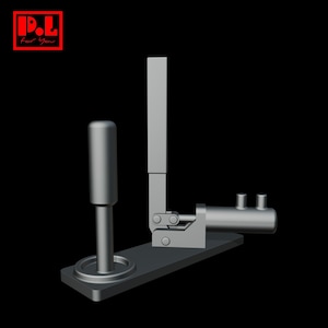 May include: A gray metal device with a cylindrical handle and a lever arm, mounted on a rectangular base. The device has a horizontal cylinder with two small protrusions. The upper left corner has the text "P.L For You" in a red box.