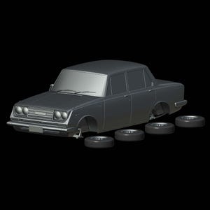 Può includere: Un'auto modello grigia con quattro pneumatici rimossi e posizionati a terra. L'auto è una berlina classica con una griglia e fari neri.