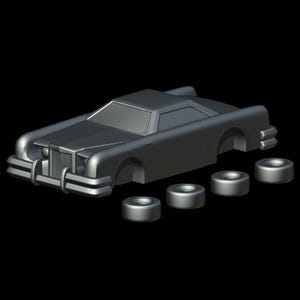 Op de afbeelding: Een grijze plastic model auto met een zwart interieur en vier zwarte wielen. De auto mist deuren en ramen.