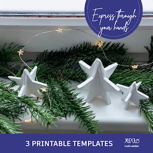 May include: White star-shaped ornaments on a windowsill, accented by a string of star-shaped lights and evergreen branches. The image includes the text "Express through your hands" and "3 Printable Templates".