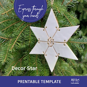 May include: White ceramic star ornament with gold wire accents. The star is hanging from a fir tree branch. The text "Express through your hands" is in a circle above the star. The text "Decor Star" is below the star. The text "PRINTABLE TEMPLATE" is below the star. The text "Mixio Craft.atelier" is in the bottom right corner.