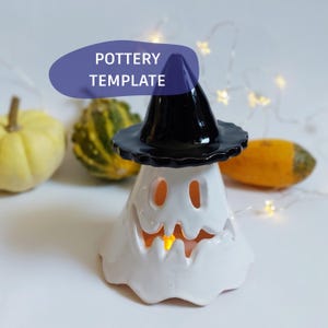 May include: A white ceramic ghost figurine wearing a black witch hat, featuring cut-out eyes and a jagged mouth. The hollow interior glows with a warm light. A purple graphic overlay with the white text POTTERY TEMPLATE is positioned above.